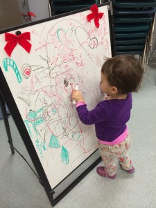 Mr. Wiskar's daughter doing her part to decorate our classrooms.